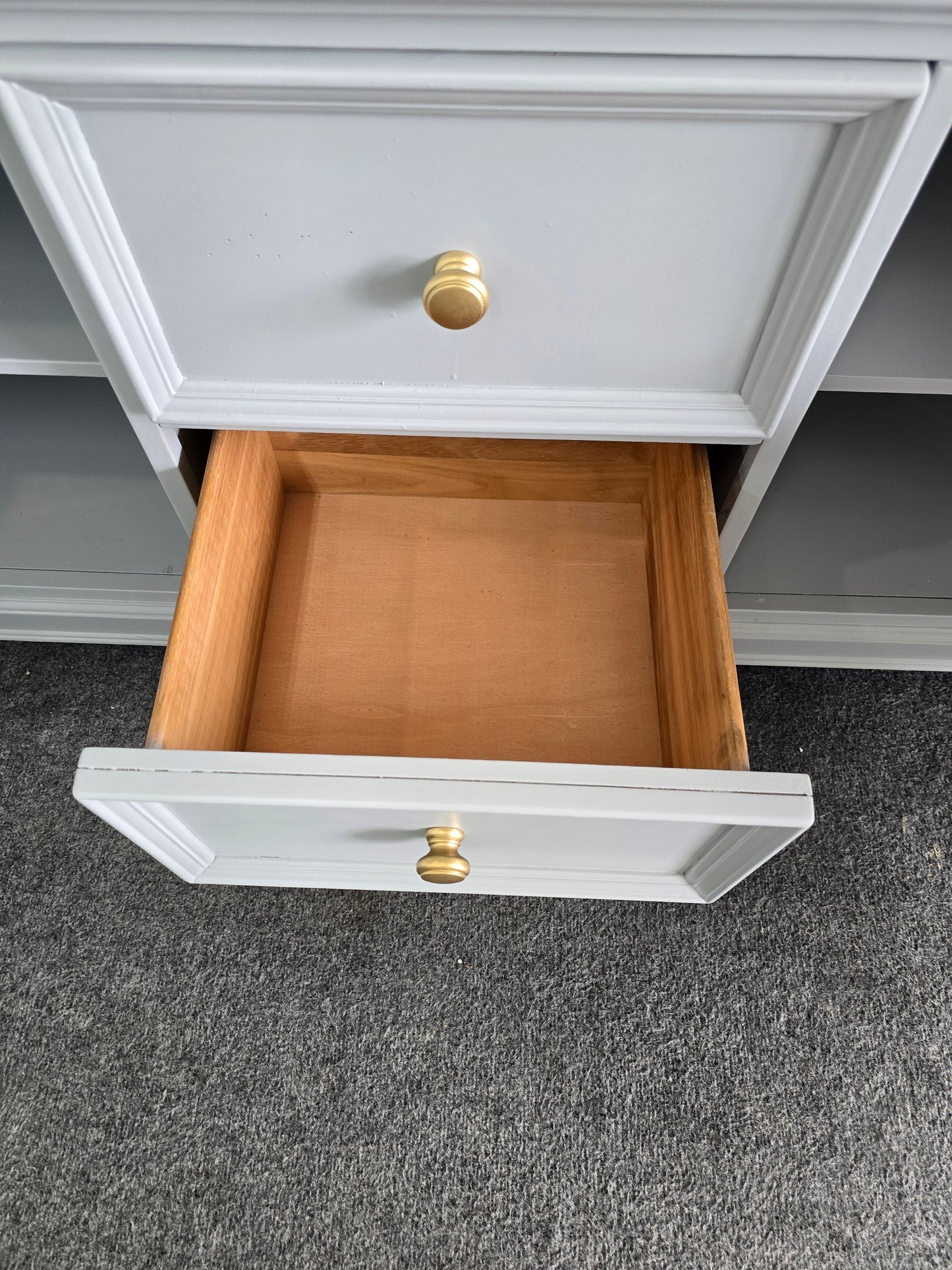 Gray dresser with golden legs