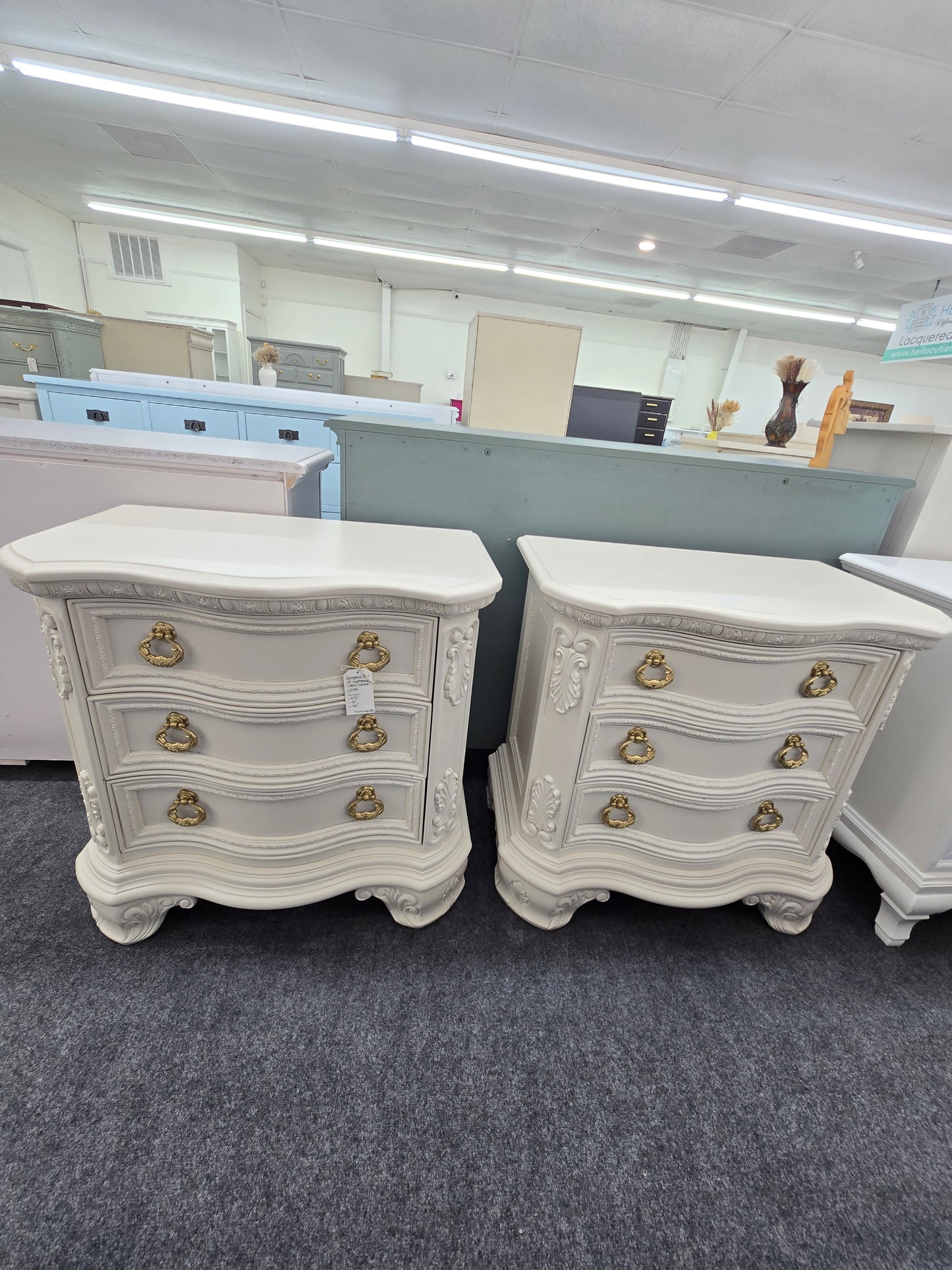 Pair of creamy carved nightstands