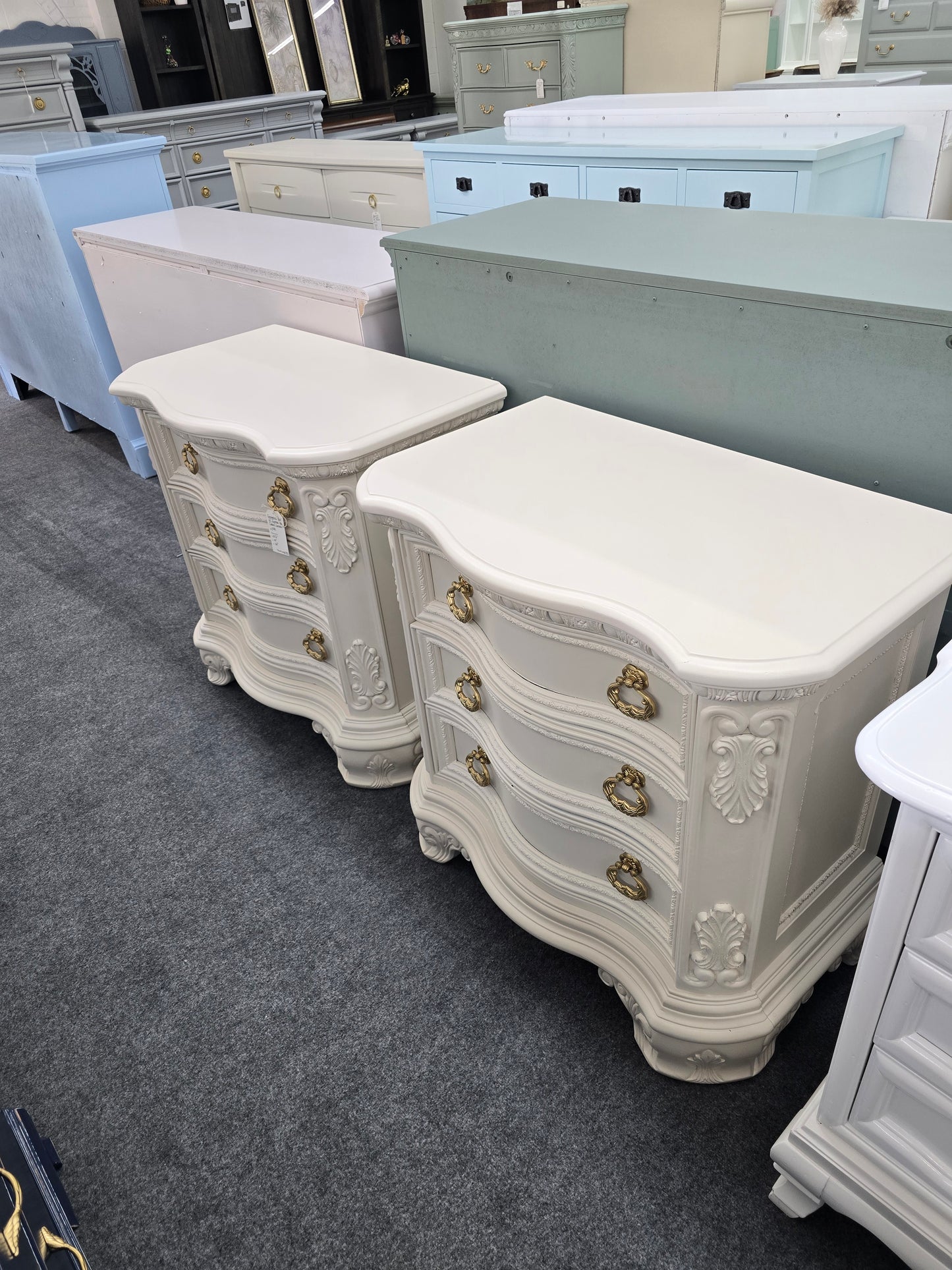 Pair of creamy carved nightstands
