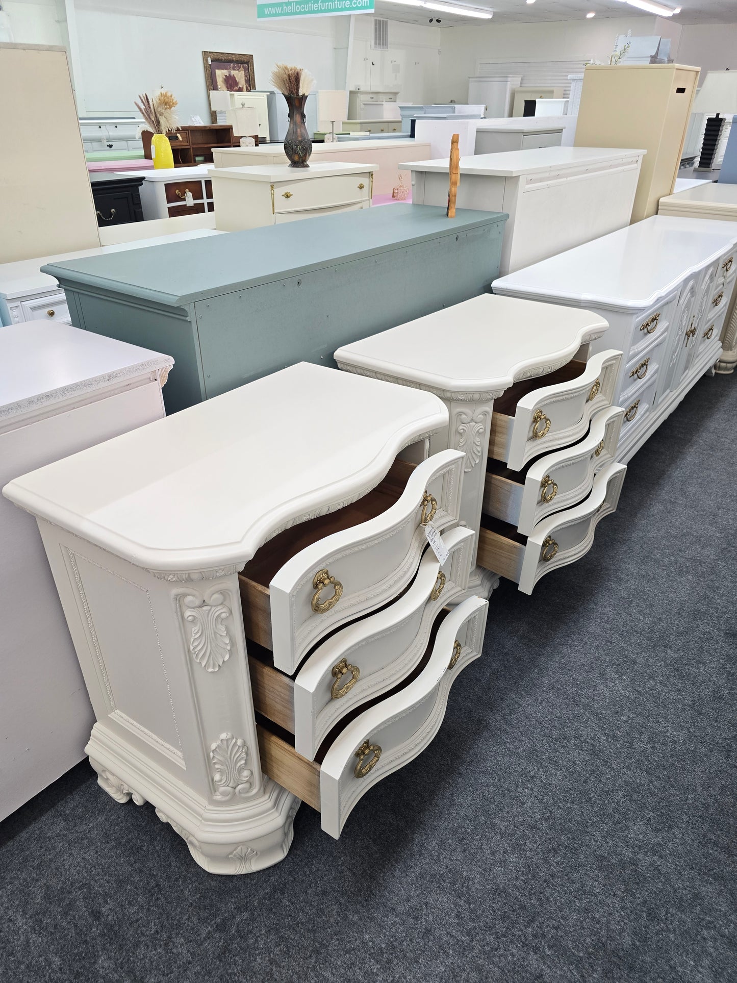 Pair of creamy carved nightstands