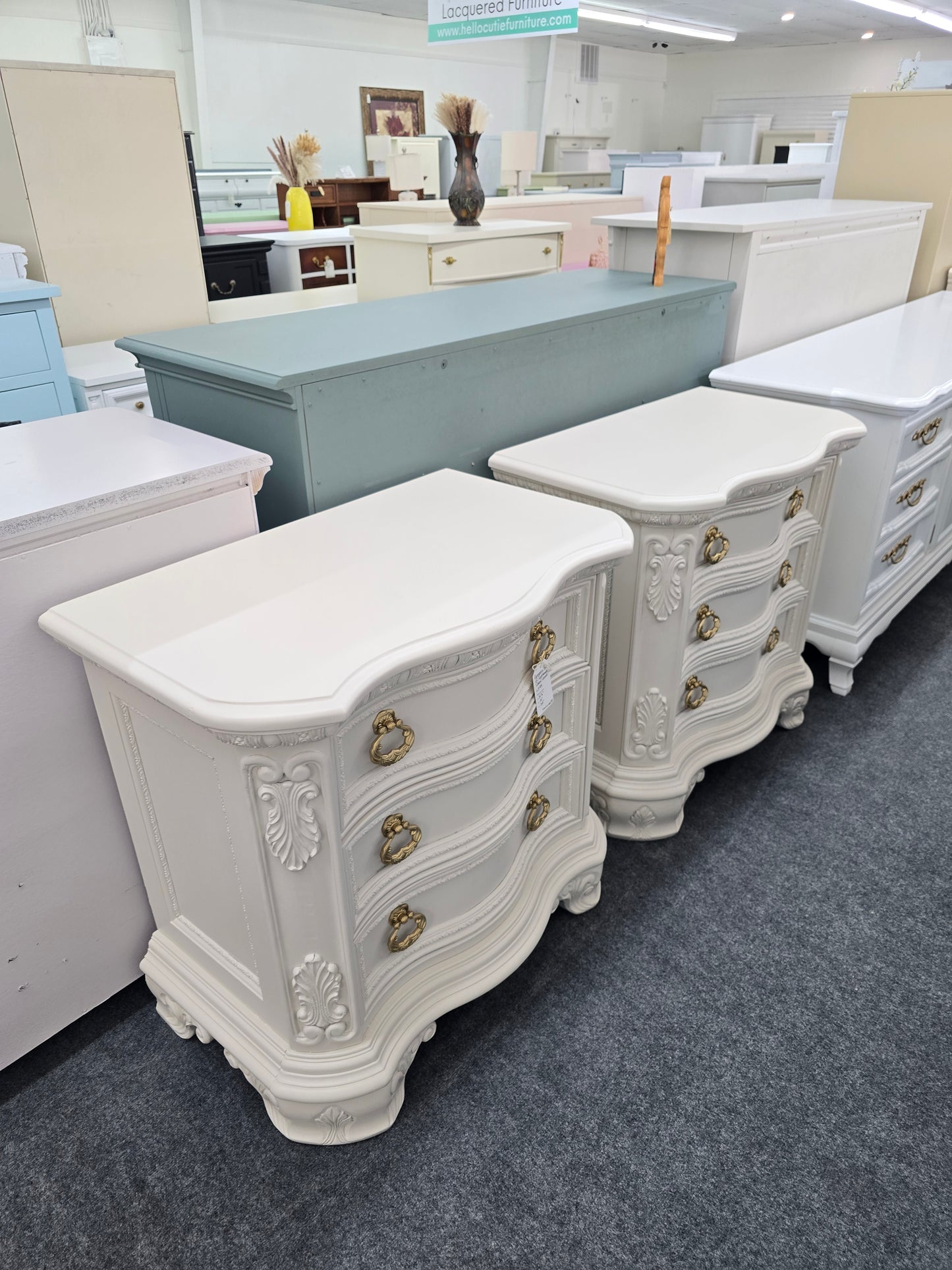 Pair of creamy carved nightstands