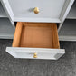 Gray dresser with golden legs