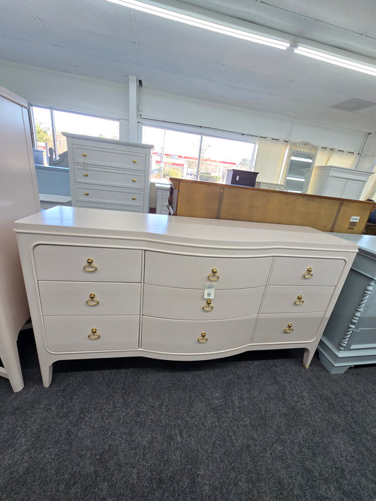 Universal soft pink lacquered dresser