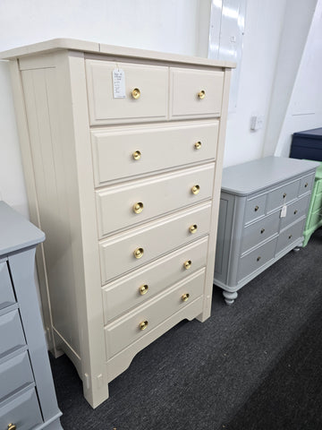 Beige tall chest of drawers