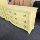 Soft yellow bowfront modern dresser