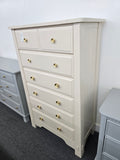 Beige tall chest of drawers