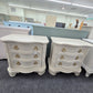 Pair of creamy carved nightstands