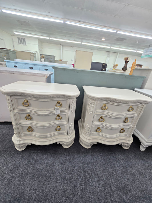Pair of creamy carved nightstands