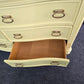 Soft yellow bowfront modern dresser