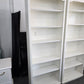2 matching off white bookshelves
