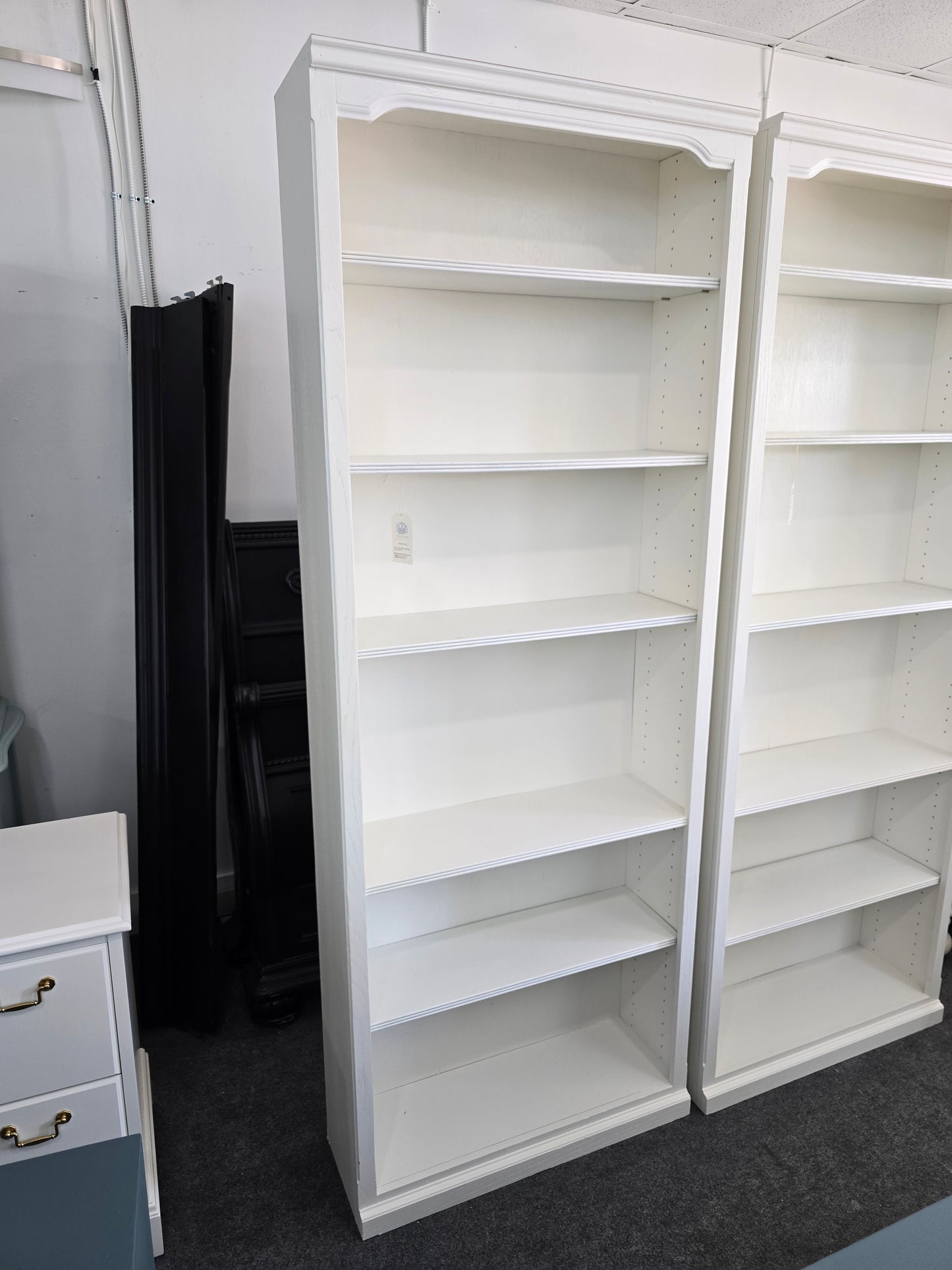 2 matching off white bookshelves