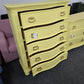 Bowfront yellow modern chest