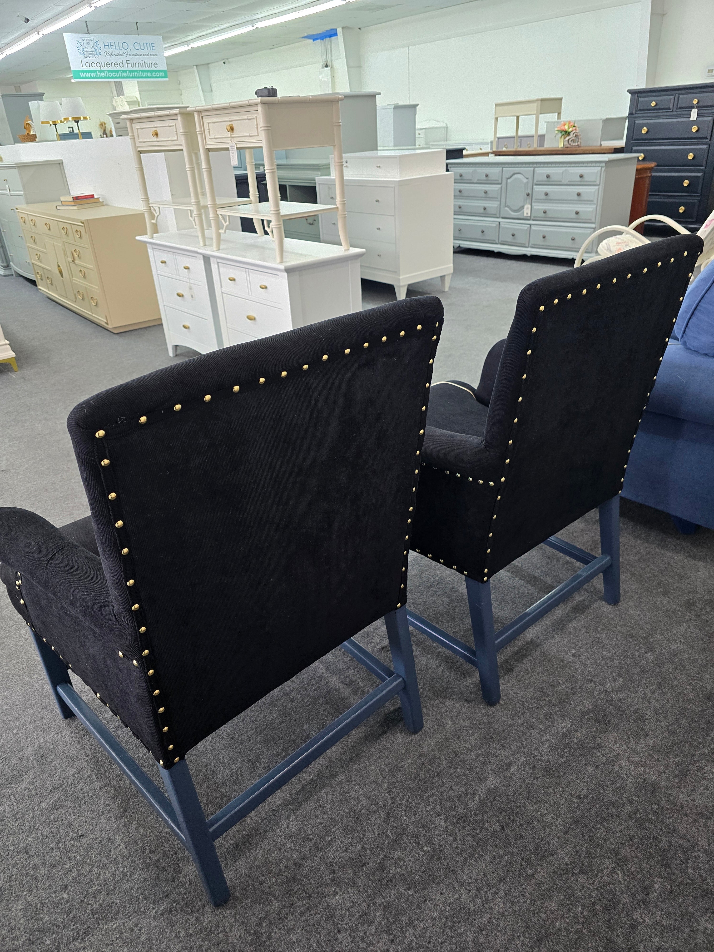 2 upholstered black chairs