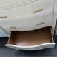 Cream lacquered bowfront chest