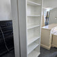 2 matching off white bookshelves