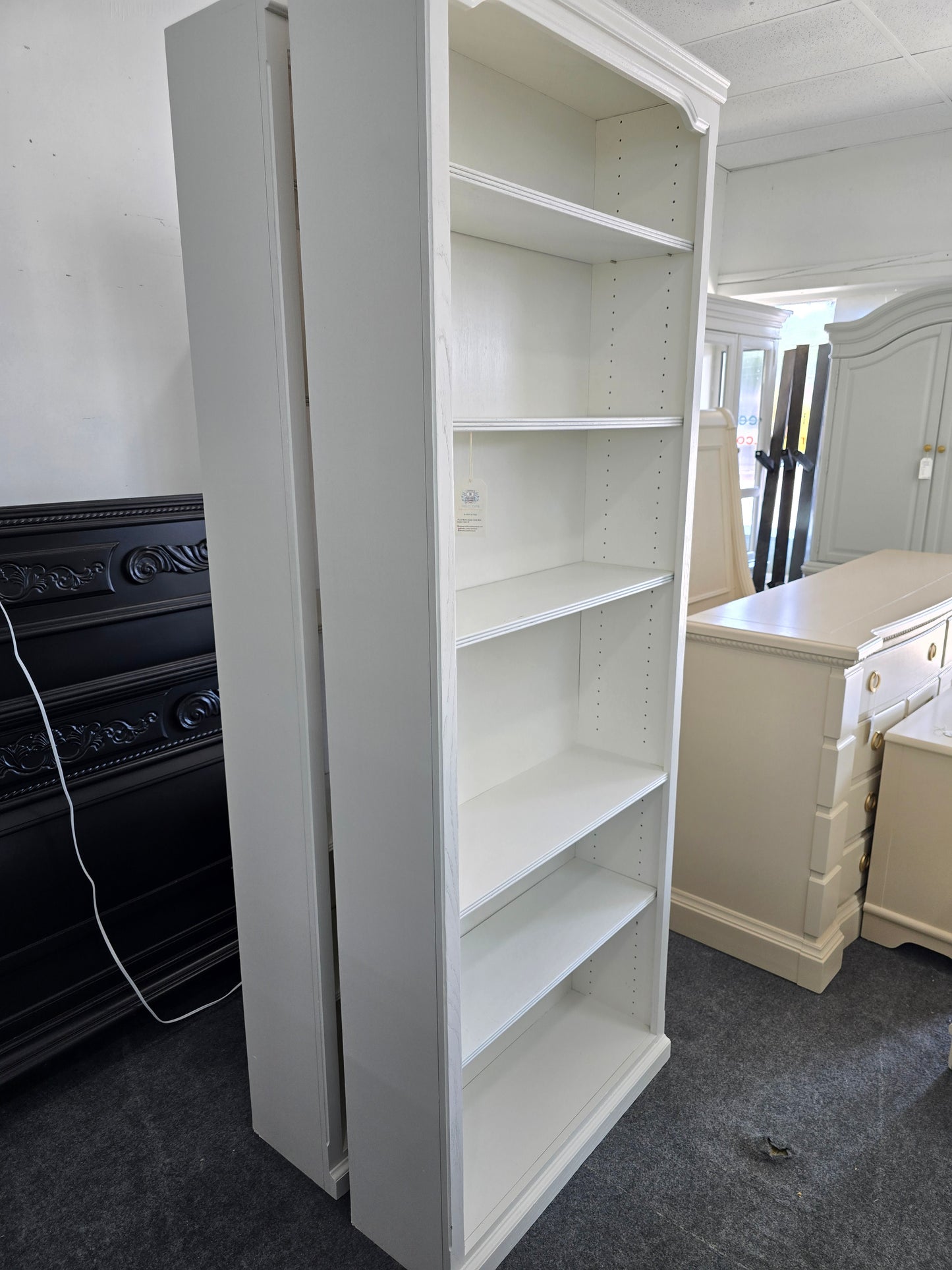 2 matching off white bookshelves