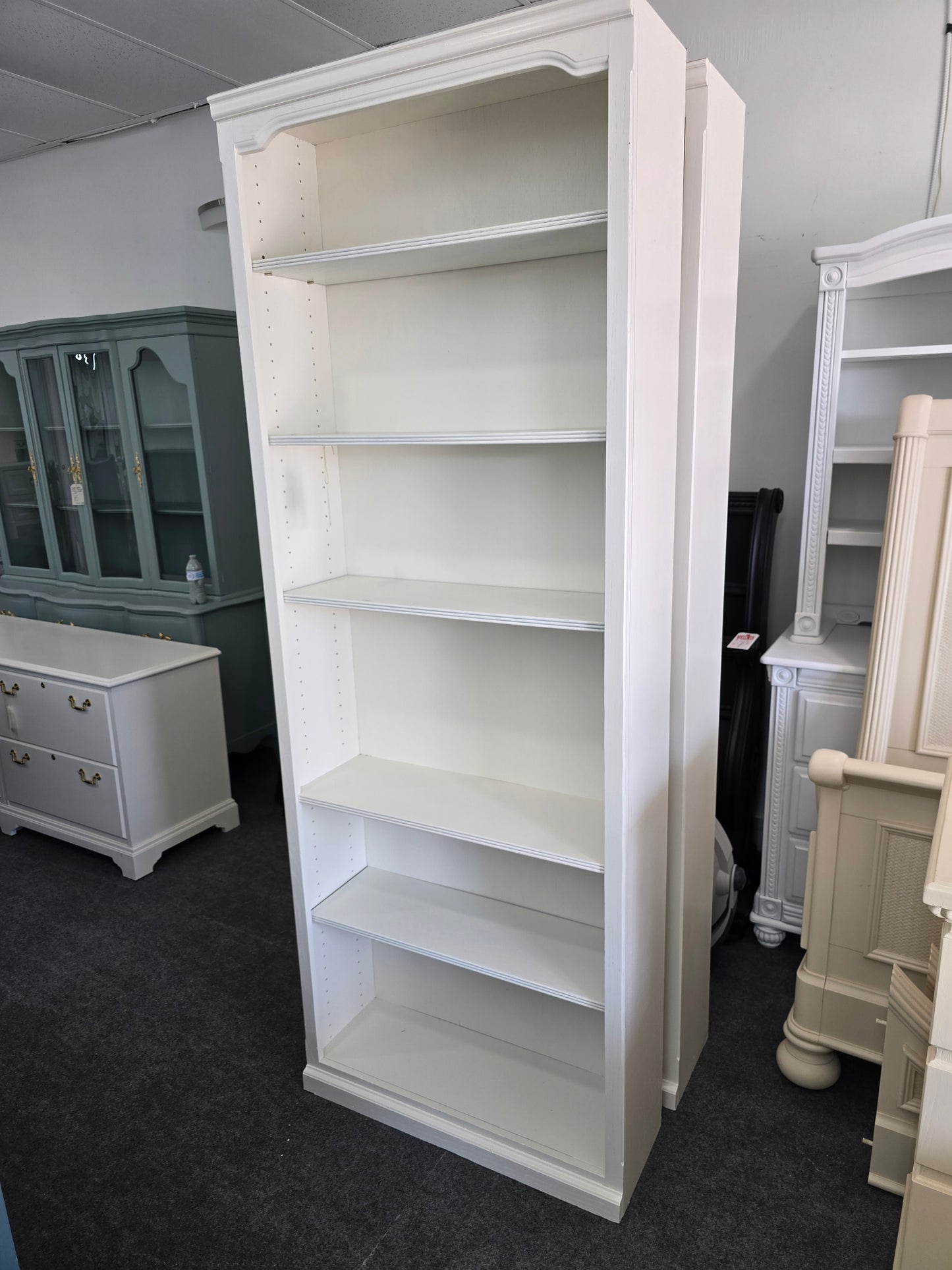 2 matching off white bookshelves