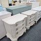 Pair of creamy carved nightstands