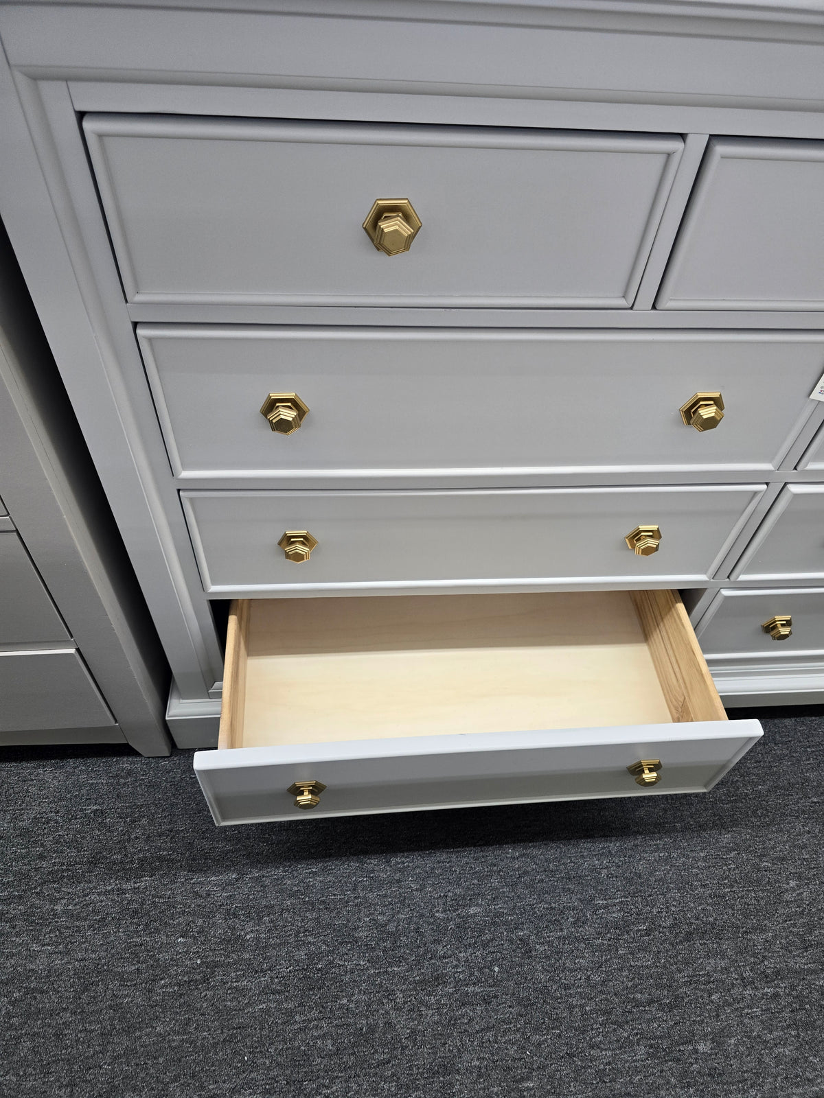 Light gray hexagon knobs dresser