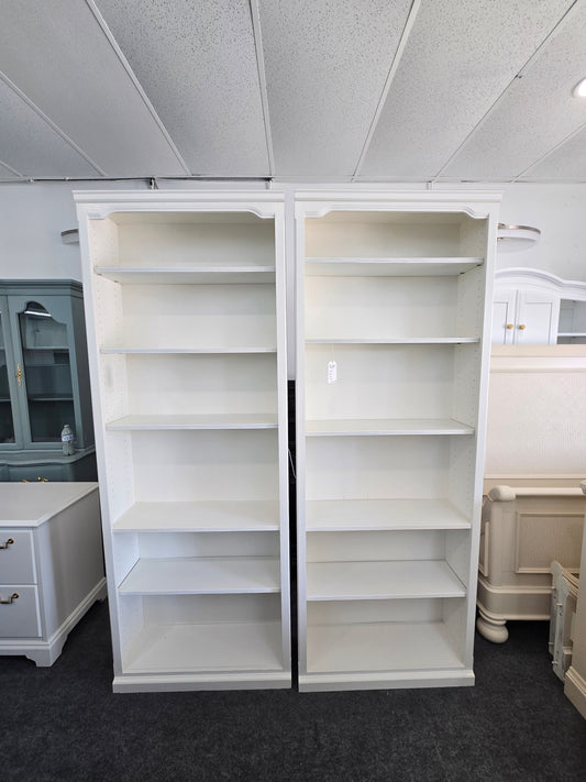 2 matching off white bookshelves
