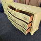 Soft yellow bowfront modern dresser