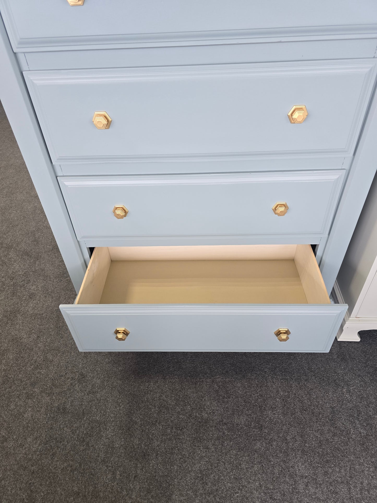 Teal chest with hexagonal knobs