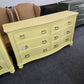 Soft yellow bowfront modern dresser