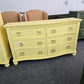 Soft yellow bowfront modern dresser