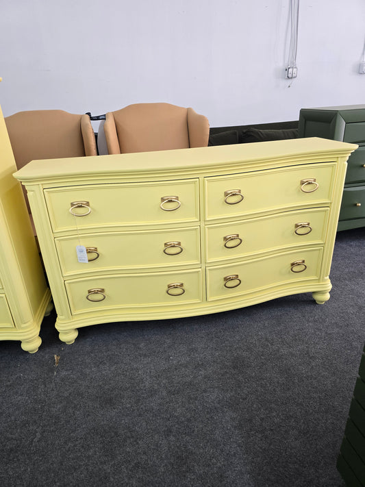 Soft yellow bowfront modern dresser