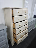 Beige tall chest of drawers